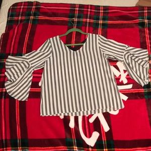 Black and white blouse with black bow in the back